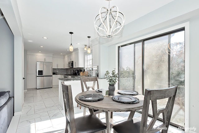 638 Dordan Ct, Gurnee, IL 60031 - dining area featuring light marble finish floors, a chandelier, and recessed lighting