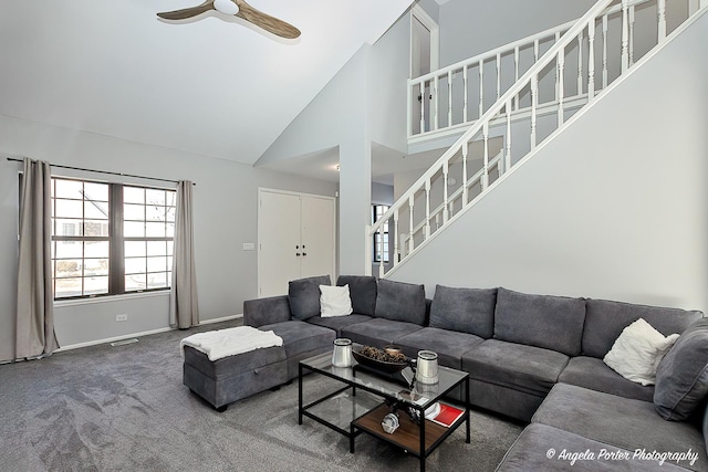 638 Dordan Ct, Gurnee, IL 60031 - carpeted living room with high vaulted ceiling, stairs, ceiling fan, and baseboards