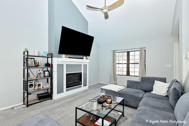 638 Dordan Ct, Gurnee, IL 60031 - living room featuring lofted ceiling, a glass covered fireplace, a ceiling fan, carpet, and baseboards
