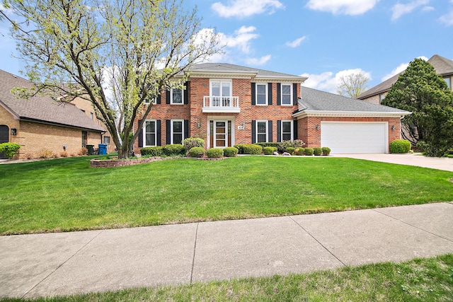 454 Hemlock Ln, Roselle, IL 60172 - colonial house featuring brick siding, an attached garage, a front lawn, and driveway