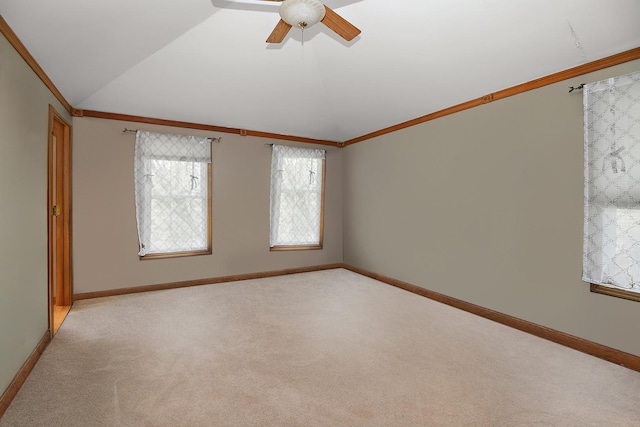 454 Hemlock Ln, Roselle, IL 60172 - empty room with vaulted ceiling, crown molding, light carpet, ceiling fan, and baseboards