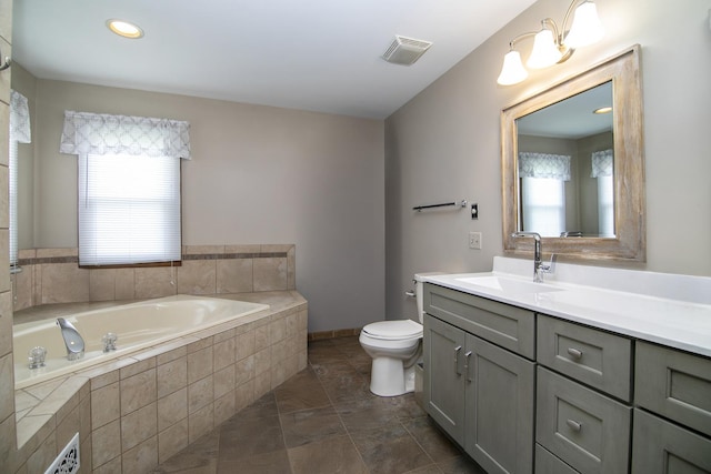 454 Hemlock Ln, Roselle, IL 60172 - full bathroom with a garden tub, vanity, and toilet