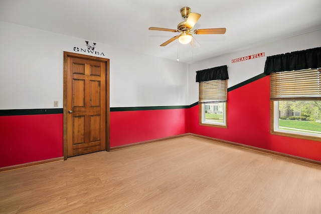 454 Hemlock Ln, Roselle, IL 60172 - spare room with wood finished floors, ceiling fan, and baseboards