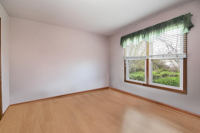 454 Hemlock Ln, Roselle, IL 60172 - spare room with wood finished floors and baseboards