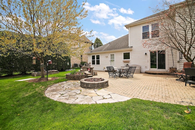 454 Hemlock Ln, Roselle, IL 60172 - back of house with a patio area, a yard, a fire pit, and roof with shingles