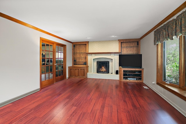 454 Hemlock Ln, Roselle, IL 60172 - unfurnished living room with a fireplace, wood finished floors, crown molding, baseboards, and french doors