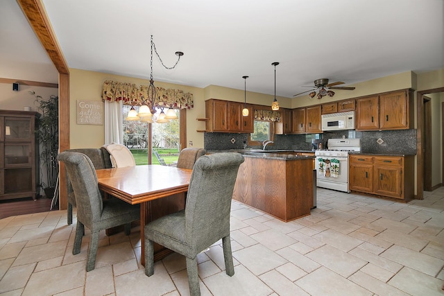 454 Hemlock Ln, Roselle, IL 60172 - dining area featuring ceiling fan and a chandelier