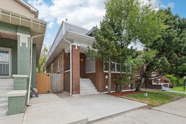 8019 S Bishop St, Chicago, IL 60620 - obstructed view of property featuring brick siding