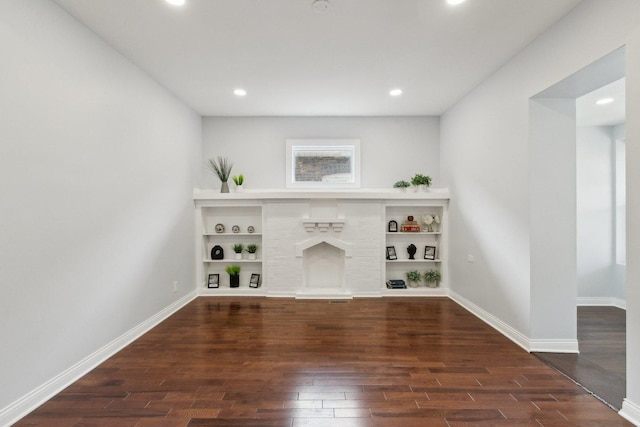 8019 S Bishop St, Chicago, IL 60620 - unfurnished living room featuring dark wood-style flooring, a fireplace, baseboards, and recessed lighting