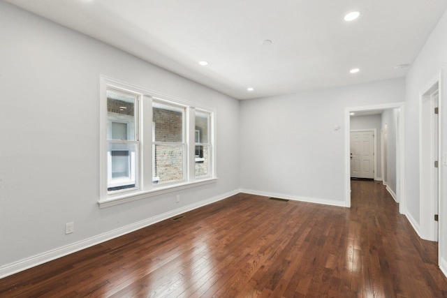 8019 S Bishop St, Chicago, IL 60620 - empty room featuring dark wood-style flooring, recessed lighting, and baseboards