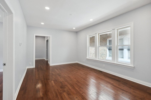 8019 S Bishop St, Chicago, IL 60620 - unfurnished room with dark wood finished floors, baseboards, and recessed lighting