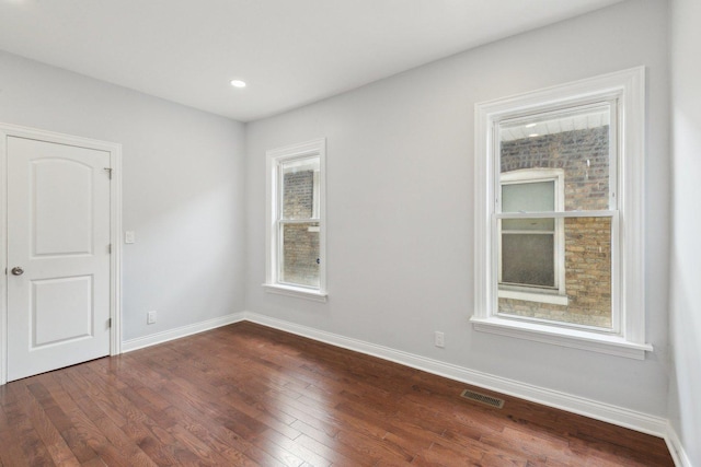 8019 S Bishop St, Chicago, IL 60620 - empty room featuring dark wood-type flooring, baseboards, and recessed lighting