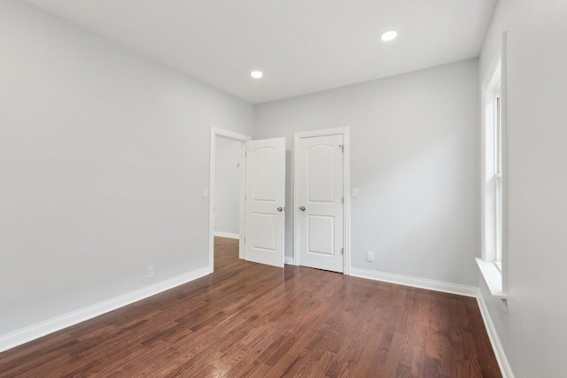 8019 S Bishop St, Chicago, IL 60620 - unfurnished bedroom with dark wood-type flooring, baseboards, and recessed lighting