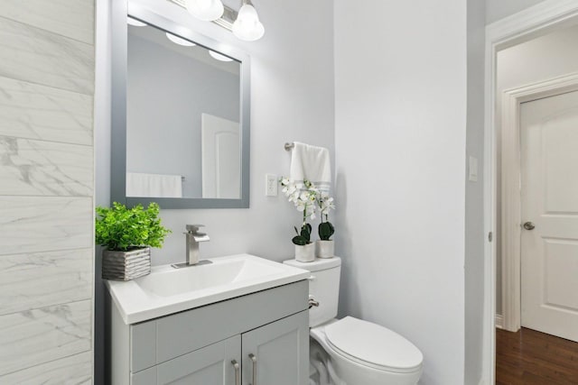 8019 S Bishop St, Chicago, IL 60620 - bathroom with vanity, toilet, and wood finished floors