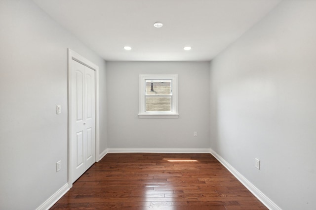 8019 S Bishop St, Chicago, IL 60620 - unfurnished bedroom featuring dark wood-style flooring, a closet, baseboards, and recessed lighting