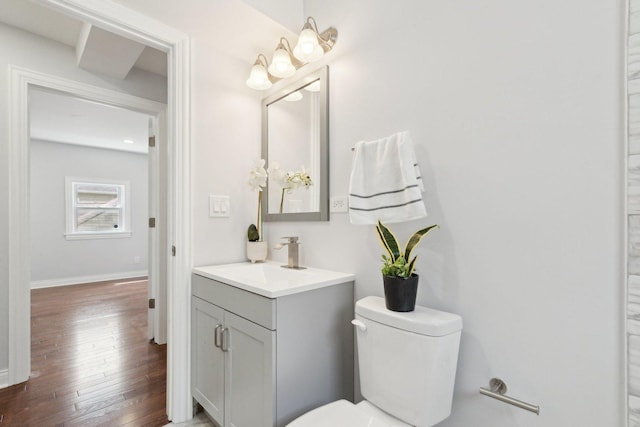 8019 S Bishop St, Chicago, IL 60620 - bathroom with vanity, hardwood / wood-style flooring, toilet, and baseboards