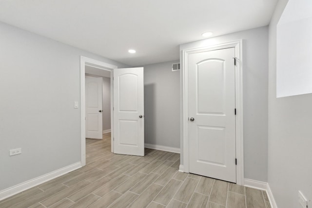 8019 S Bishop St, Chicago, IL 60620 - unfurnished bedroom featuring baseboards, light wood-type flooring, and recessed lighting