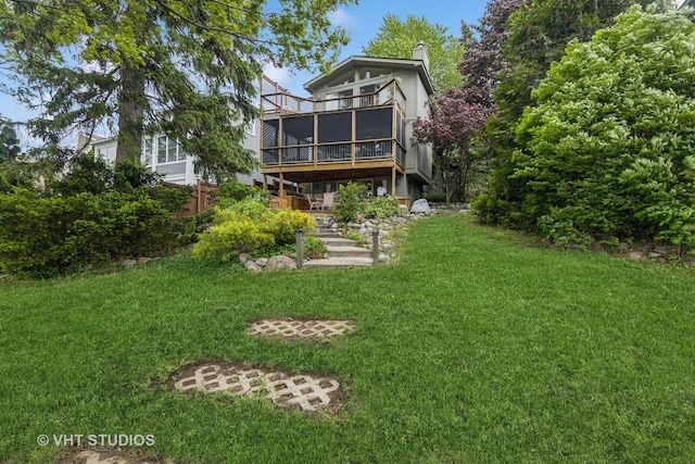 18 N Lake Ave, Fox Lake, IL 60020 - back of house with a sunroom, a yard, a chimney, and a deck