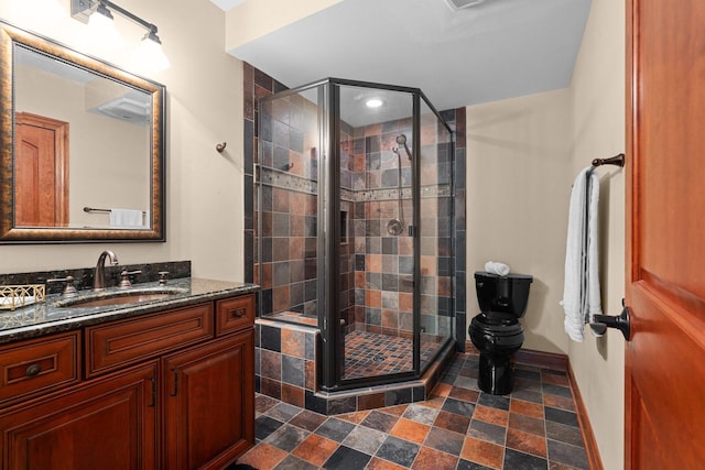28809 W Harvest Glen Cir, Cary, IL 60013 - full bathroom featuring vanity, a stall shower, stone finish flooring, and toilet