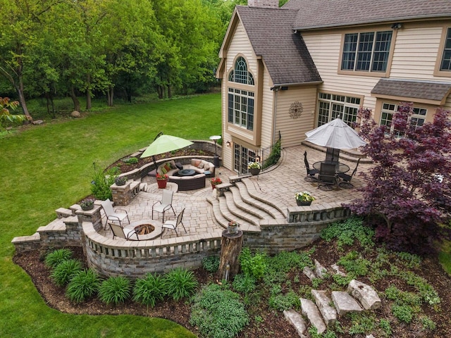 28809 W Harvest Glen Cir, Cary, IL 60013 - view of grassy yard with a fire pit and a patio