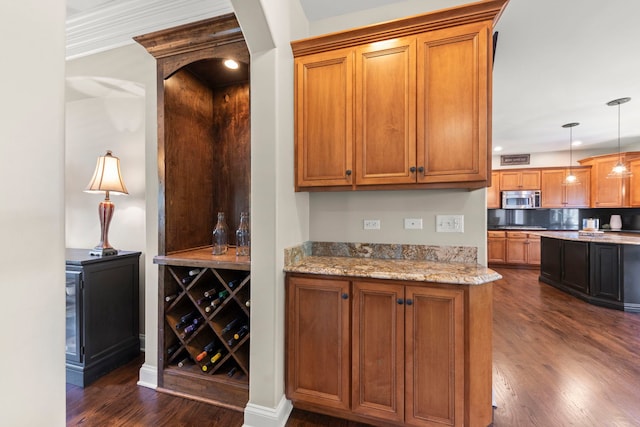12923 Grande Pines Blvd, Plainfield, IL 60585 - kitchen with stainless steel microwave, dark wood-type flooring, light stone counters, brown cabinets, and recessed lighting