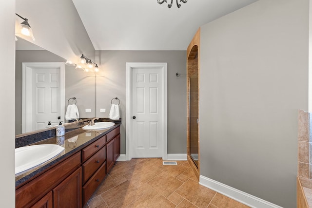 12923 Grande Pines Blvd, Plainfield, IL 60585 - bathroom with double vanity, a shower stall, and baseboards
