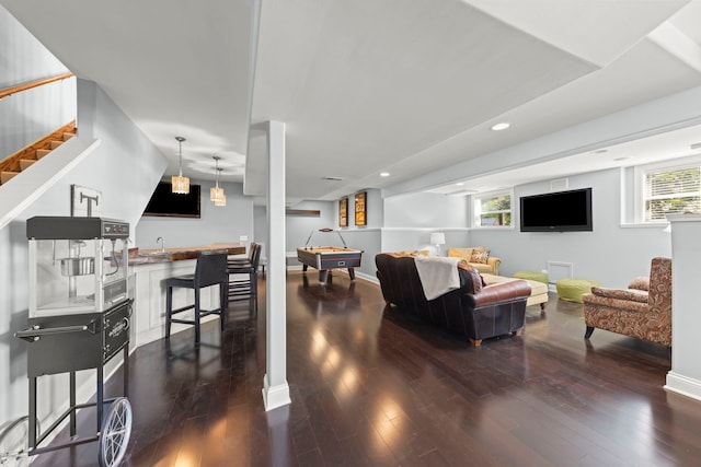 12923 Grande Pines Blvd, Plainfield, IL 60585 - living area featuring wood finished floors, plenty of natural light, stairway, bar with sink, and recessed lighting