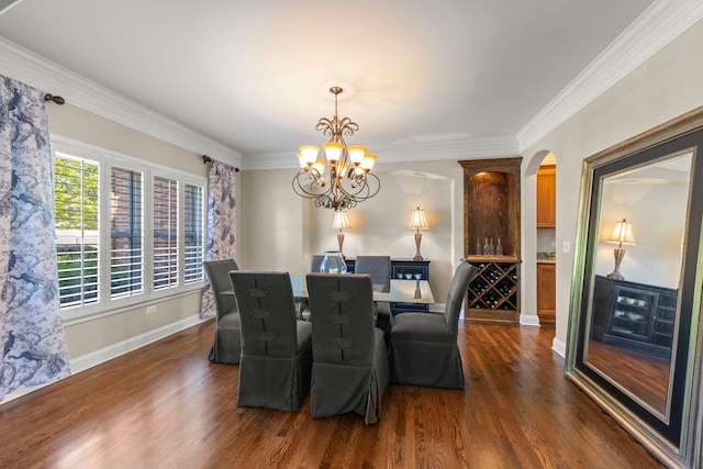 12923 Grande Pines Blvd, Plainfield, IL 60585 - dining area featuring dark wood-style floors, arched walkways, a chandelier, ornamental molding, and baseboards