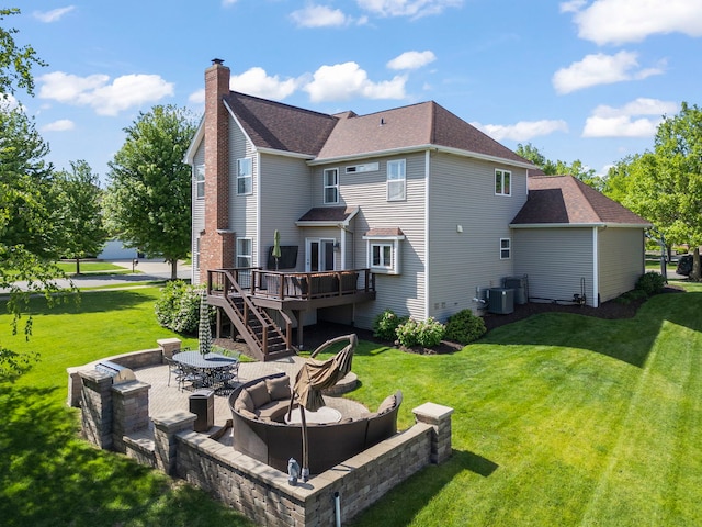 12923 Grande Pines Blvd, Plainfield, IL 60585 - rear view of house featuring a wooden deck, an outdoor fire pit, a chimney, a yard, and a patio area