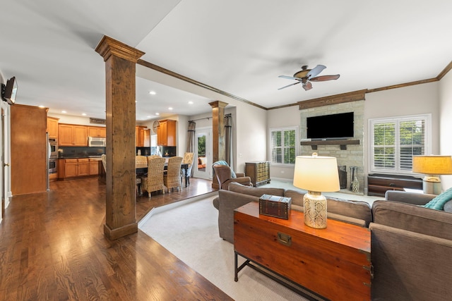 12923 Grande Pines Blvd, Plainfield, IL 60585 - living area featuring decorative columns, ceiling fan, dark wood-style flooring, recessed lighting, and crown molding