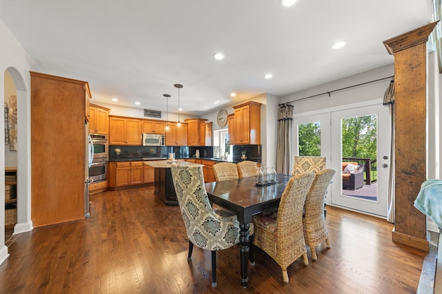12923 Grande Pines Blvd, Plainfield, IL 60585 - dining space featuring recessed lighting, dark wood-type flooring, and arched walkways
