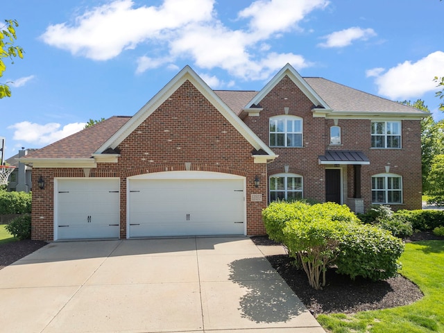 12923 Grande Pines Blvd, Plainfield, IL 60585 - colonial home with brick siding, an attached garage, driveway, and roof with shingles
