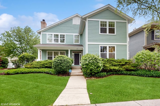 296 Huron St, Vernon Hills, IL 60061 - view of front of property featuring a chimney and a front lawn