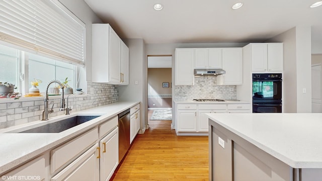 296 Huron St, Vernon Hills, IL 60061 - kitchen featuring a sink, dishwasher, gas cooktop, decorative backsplash, and light wood finished floors