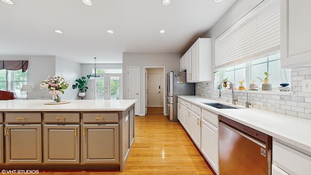 296 Huron St, Vernon Hills, IL 60061 - kitchen with appliances with stainless steel finishes, a sink, white cabinetry, backsplash, and recessed lighting