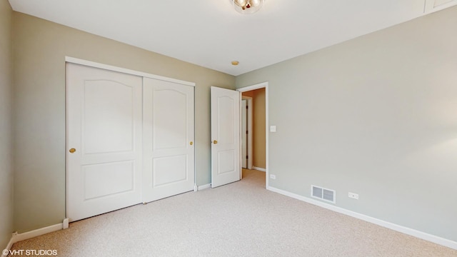 296 Huron St, Vernon Hills, IL 60061 - unfurnished bedroom featuring baseboards, light carpet, and a closet