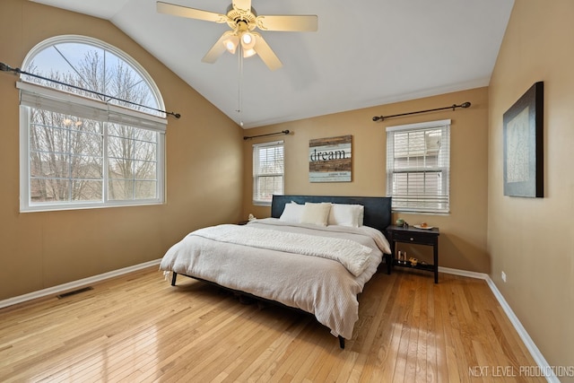 1839 Tamahawk Ln, Naperville, IL 60564 - bedroom with vaulted ceiling, light wood-style floors, multiple windows, baseboards, and ceiling fan
