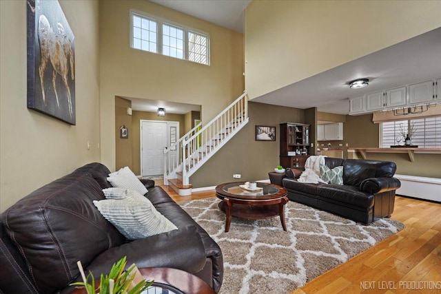 1839 Tamahawk Ln, Naperville, IL 60564 - living area featuring wood-type flooring, stairway, and a high ceiling