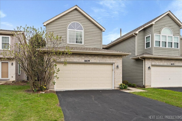 1839 Tamahawk Ln, Naperville, IL 60564 - view of front of home featuring a garage, asphalt driveway, a front lawn, and brick siding