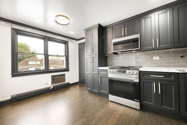 6964 W Diversey Ave Unit 6, Chicago, IL 60707 - kitchen with appliances with stainless steel finishes, light countertops, dark wood finished floors, backsplash, and crown molding