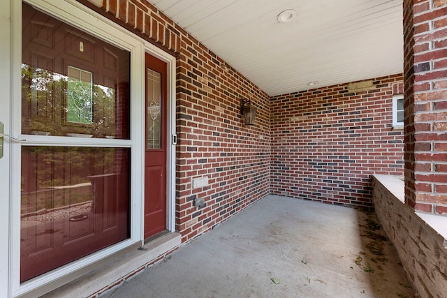 1912 Indian Trl, Kankakee, IL 60901 - doorway to property featuring a porch and brick siding