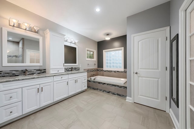 1912 Indian Trl, Kankakee, IL 60901 - full bathroom featuring double vanity and a bath
