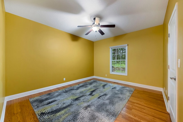 1912 Indian Trl, Kankakee, IL 60901 - unfurnished room with a ceiling fan, baseboards, and wood finished floors