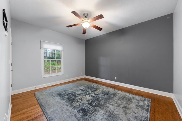 1912 Indian Trl, Kankakee, IL 60901 - empty room featuring ceiling fan, baseboards, and wood finished floors