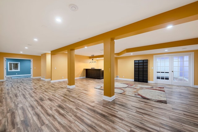 1912 Indian Trl, Kankakee, IL 60901 - unfurnished living room with wood finished floors, wet bar, baseboards, and recessed lighting
