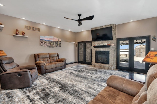 10739 E 3200 N Rd, Blackstone, IL 61313 - living room featuring ceiling fan, recessed lighting, a fireplace, and french doors