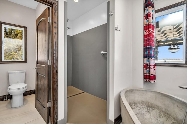 10739 E 3200 N Rd, Blackstone, IL 61313 - full bath with toilet, baseboards, and curtained shower
