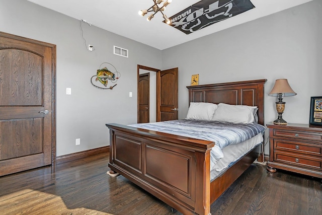10739 E 3200 N Rd, Blackstone, IL 61313 - bedroom with dark wood finished floors, a chandelier, and baseboards