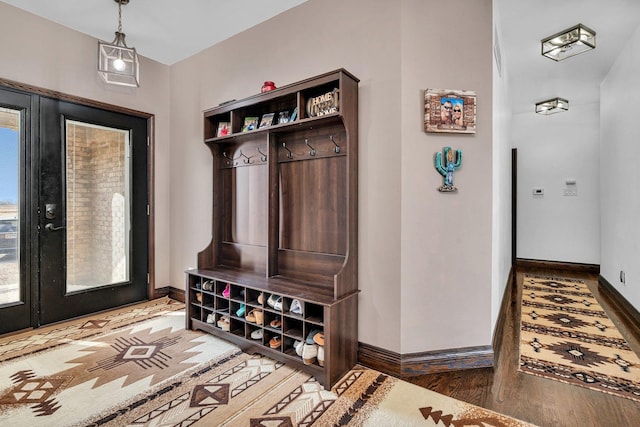 10739 E 3200 N Rd, Blackstone, IL 61313 - mudroom featuring baseboards and wood finished floors