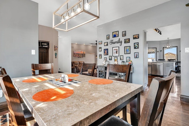 10739 E 3200 N Rd, Blackstone, IL 61313 - dining area with dark wood-type flooring and a chandelier
